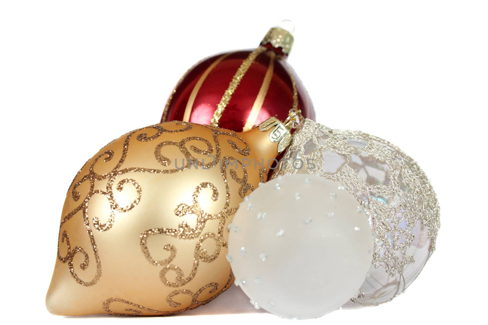 Different colored christmas ball decorations on white background