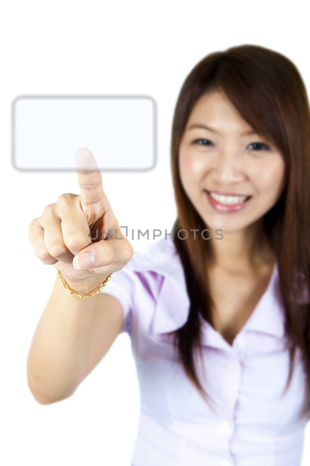 Young woman on white background is pressing on empty space