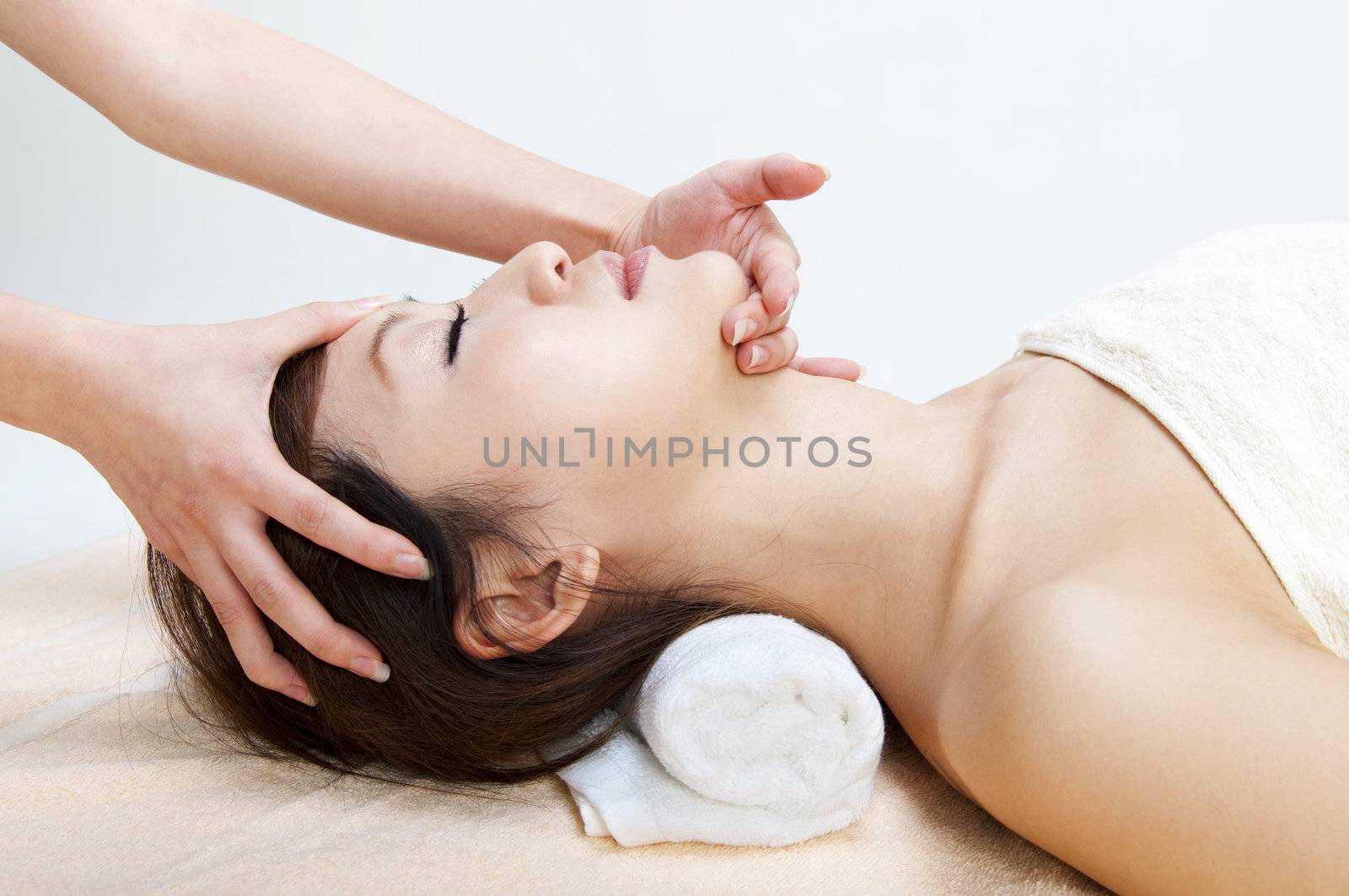 Beauty and Spa - Young Girl having a massage on her face