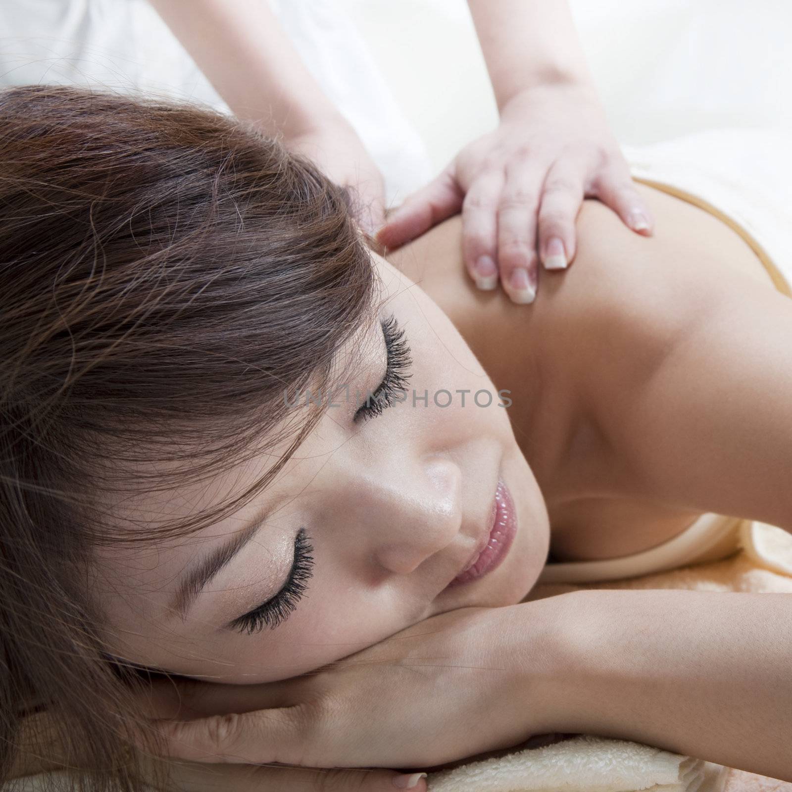 Beauty and Spa - Asian Girl having a massage on her back