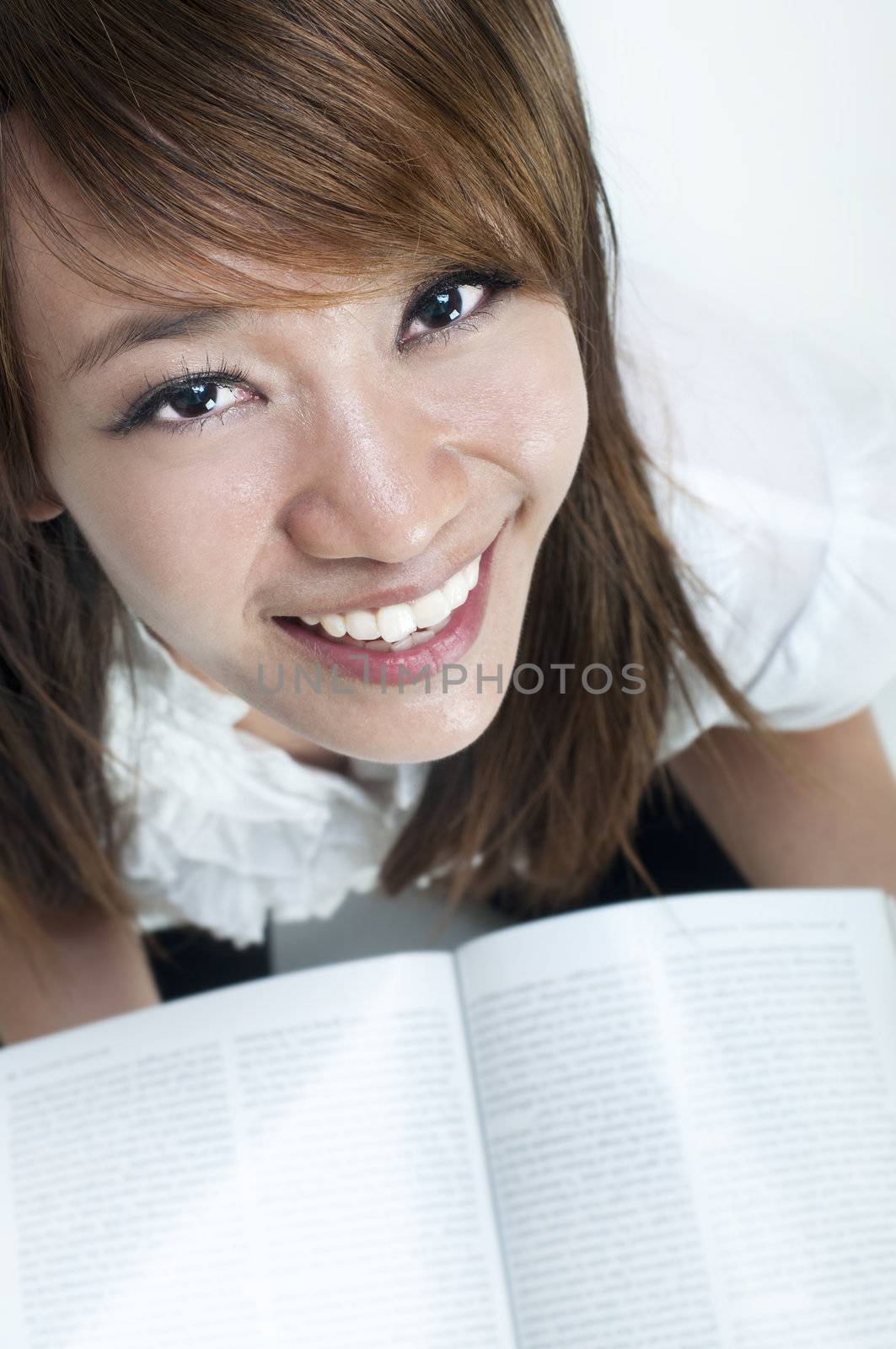 Young college student is studying, face looking up.