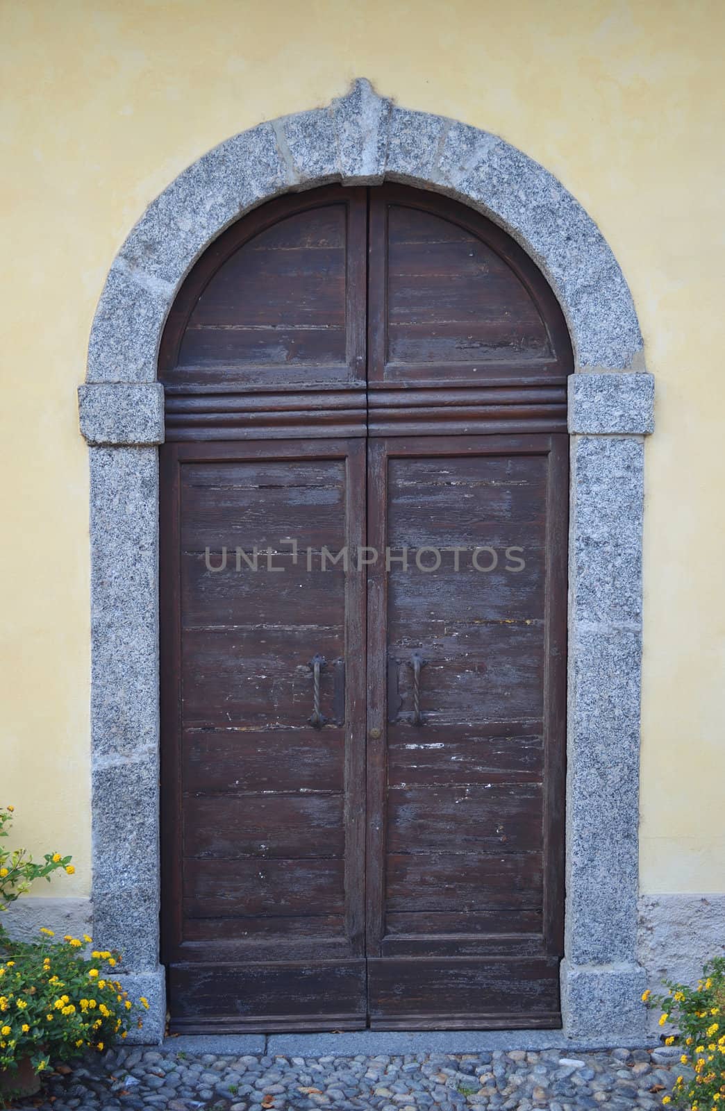 Old wood and stone external door or gate