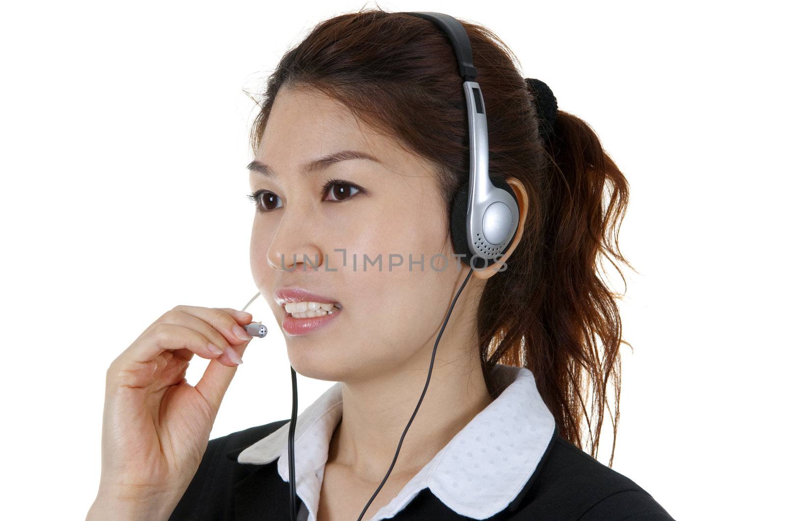 Friendly Customer Representative with headset smiling during a telephone conversation