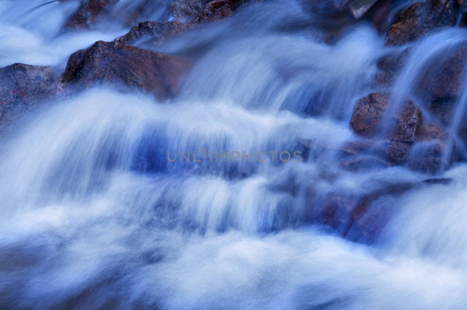 Natural waterfall in tropical rainforest Malaysia in dawn.