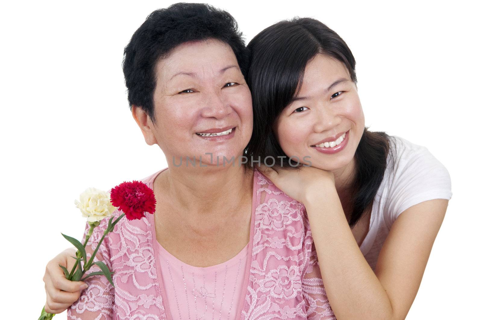 Happy Asian Mother and Adult Daughter with carnation flower