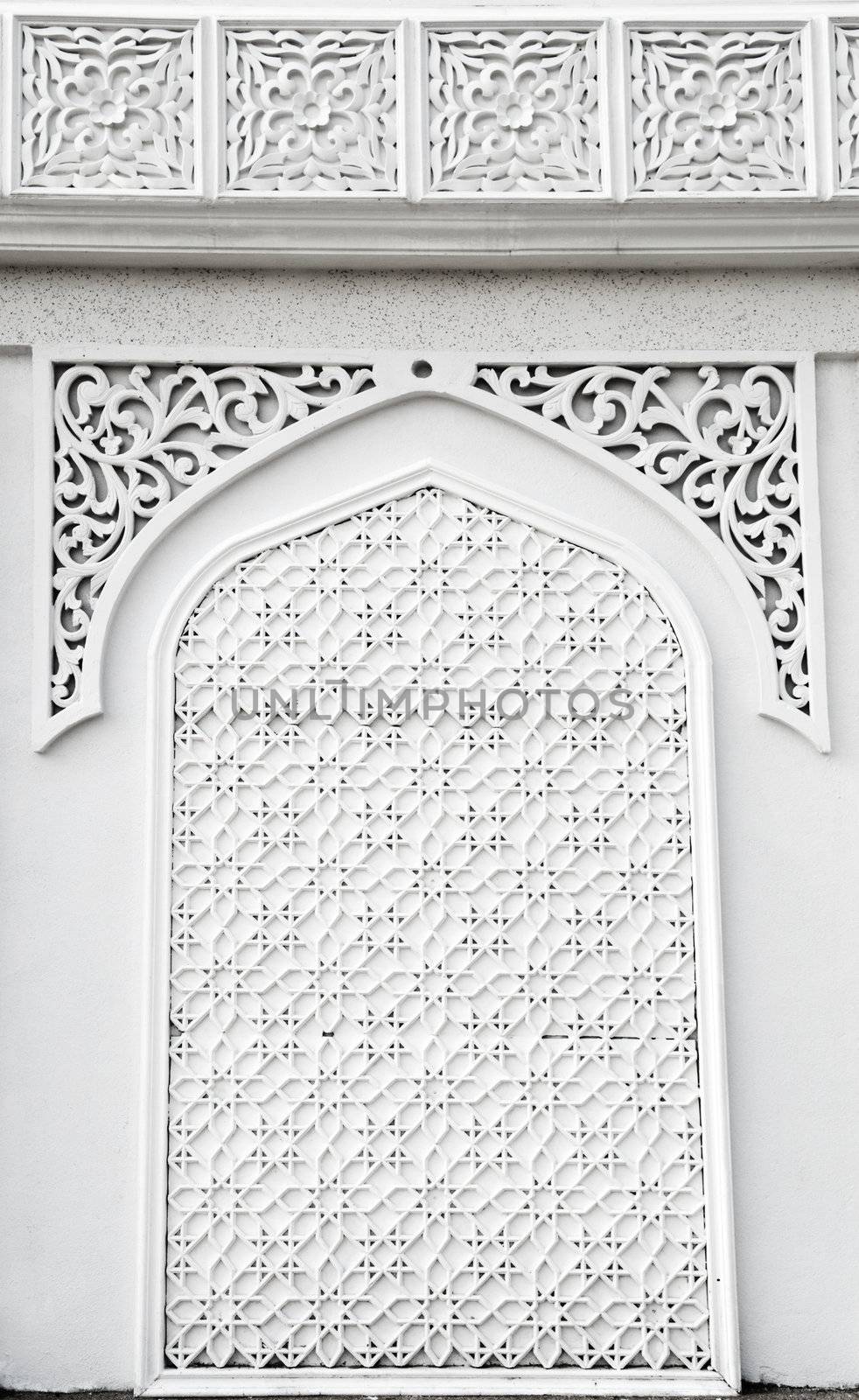 An example of Islamic mosque design cast in concrete on a building in Terengganu, Malaysia.