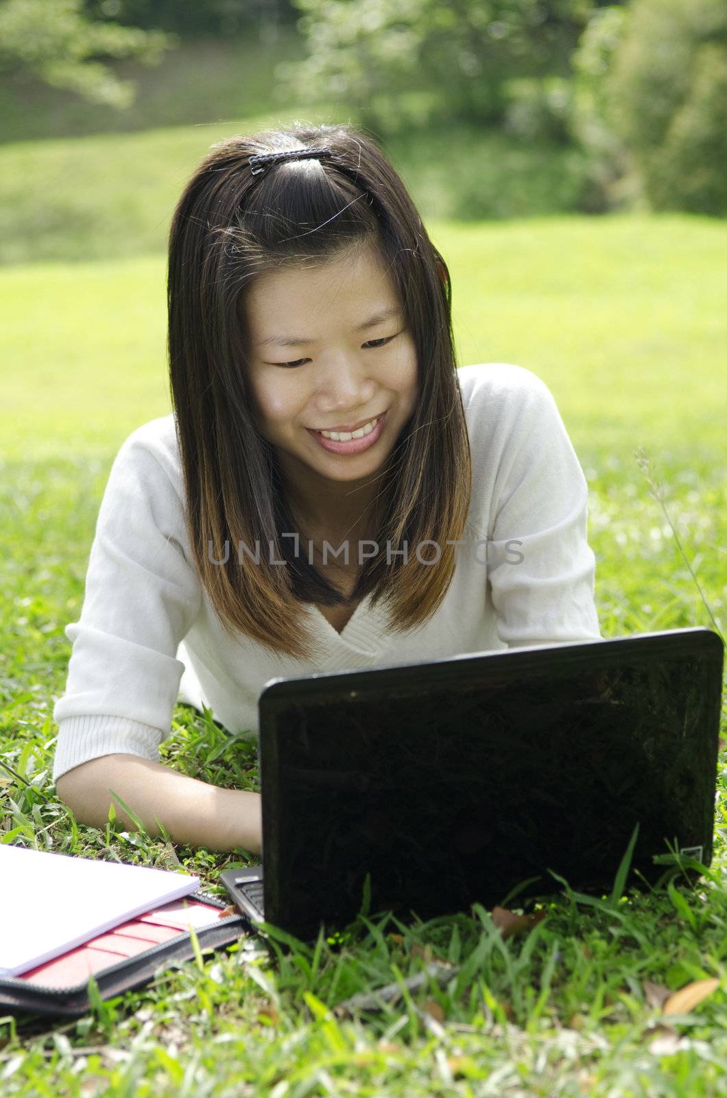 Asian Student Using Laptop Outside School Campus