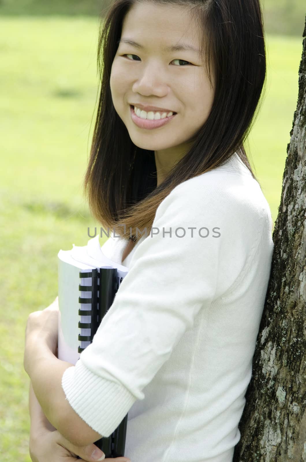 Asian college student smiling, outdoor.