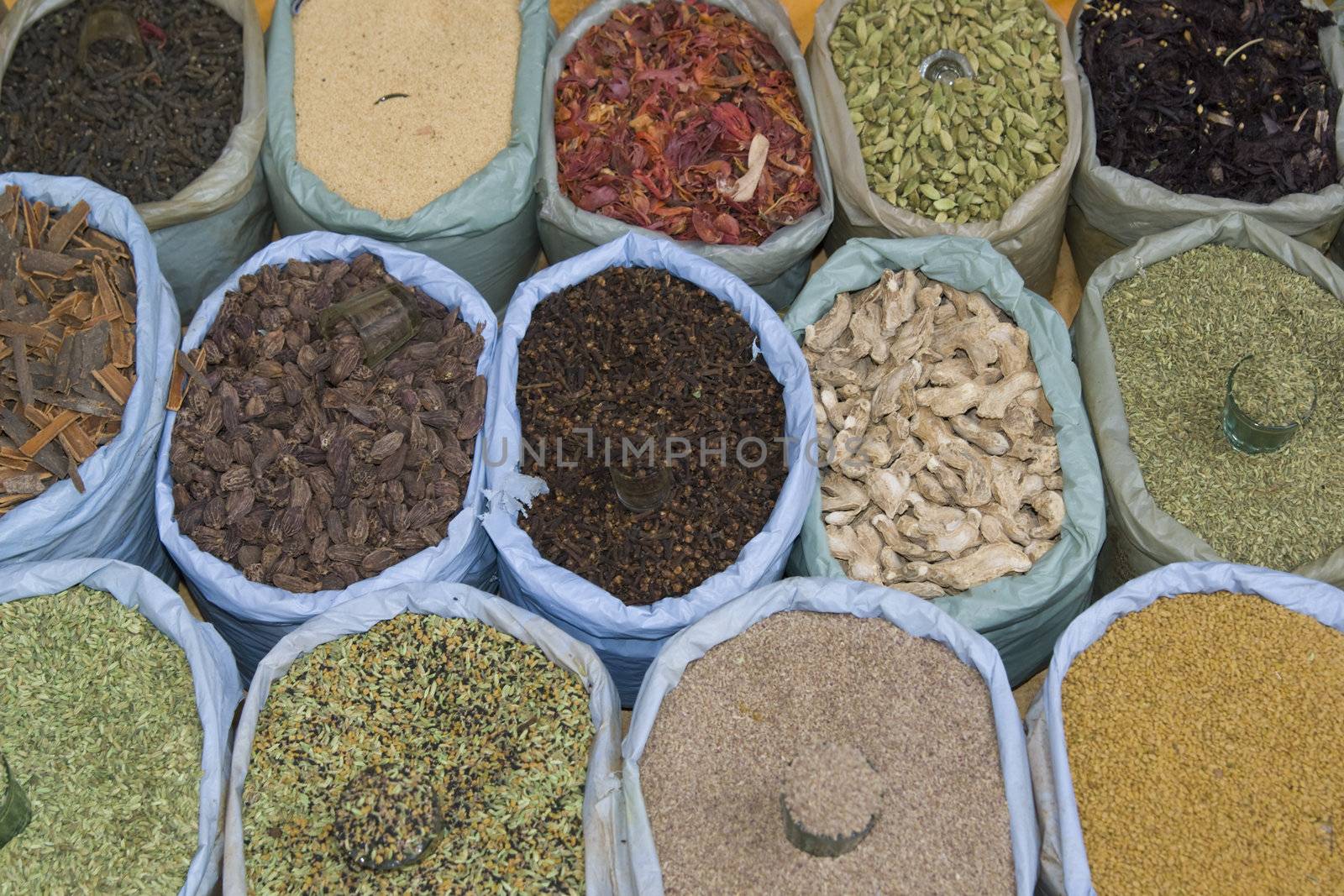 Colorful arrangement of spices for sale at a market stall in Old delhi, India