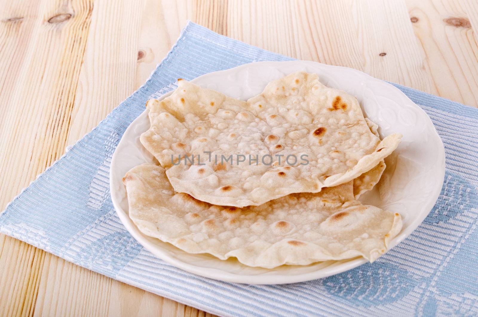 Indian staple food made of wheat flour, traditional unleavened bread to eat with curry.