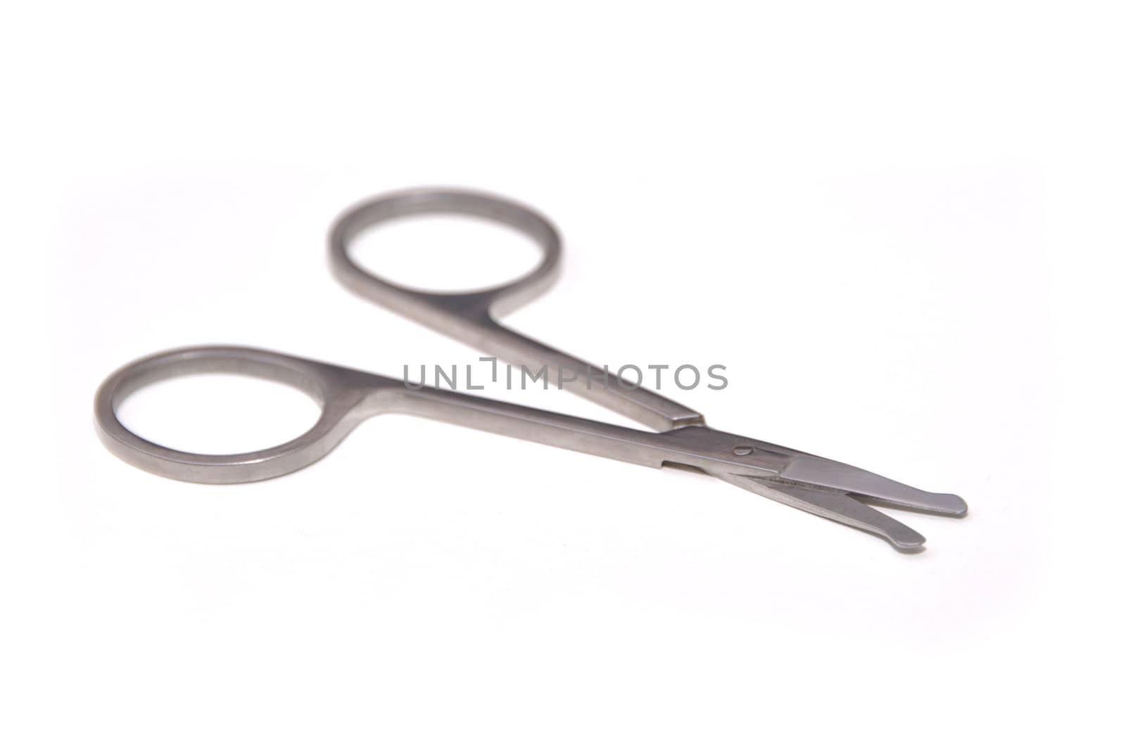 Stainless steel scissors on isolated white background