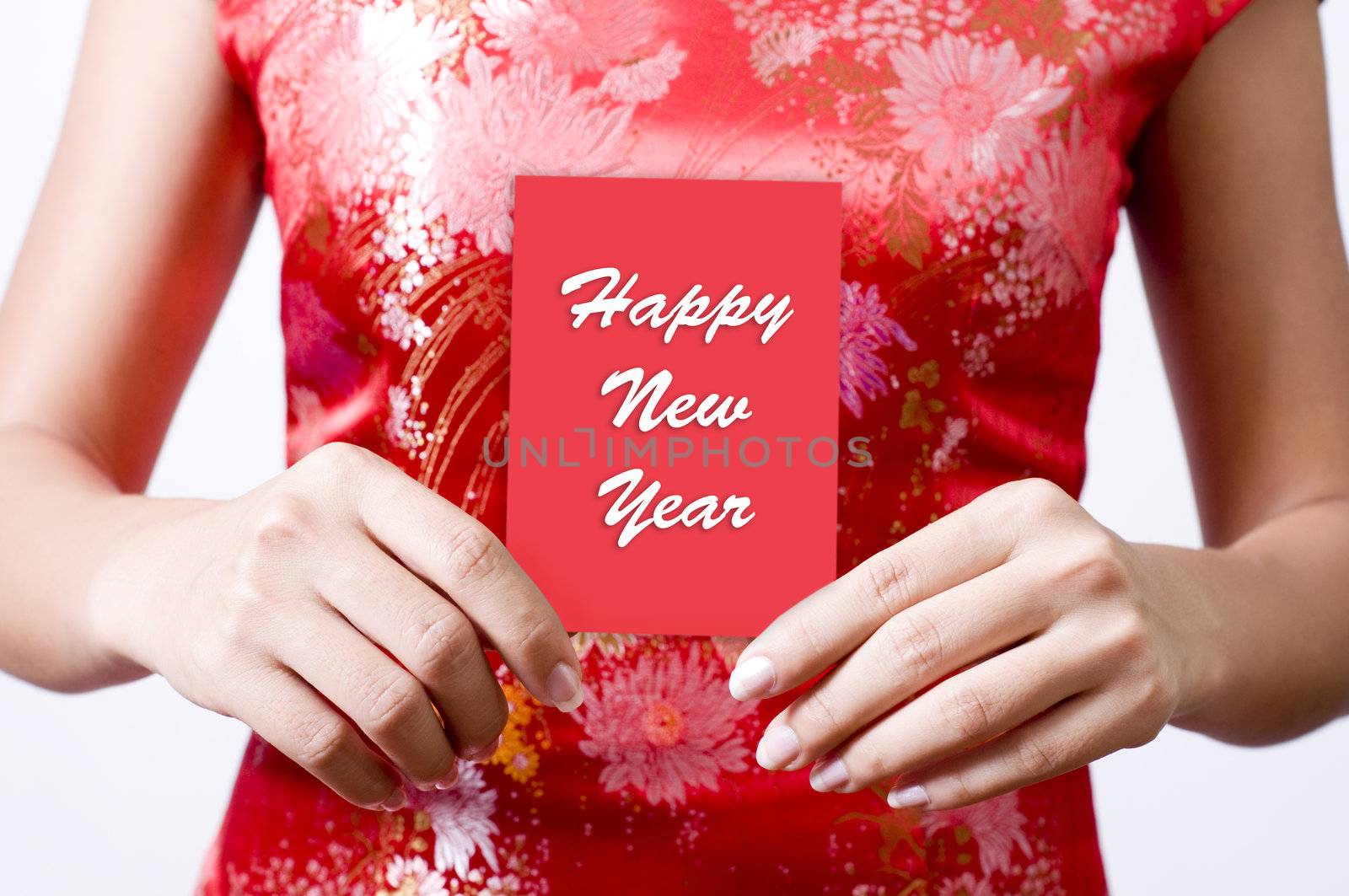 Oriental girl with red Cheongsam holding a red packet wishing you Happy New Year 
