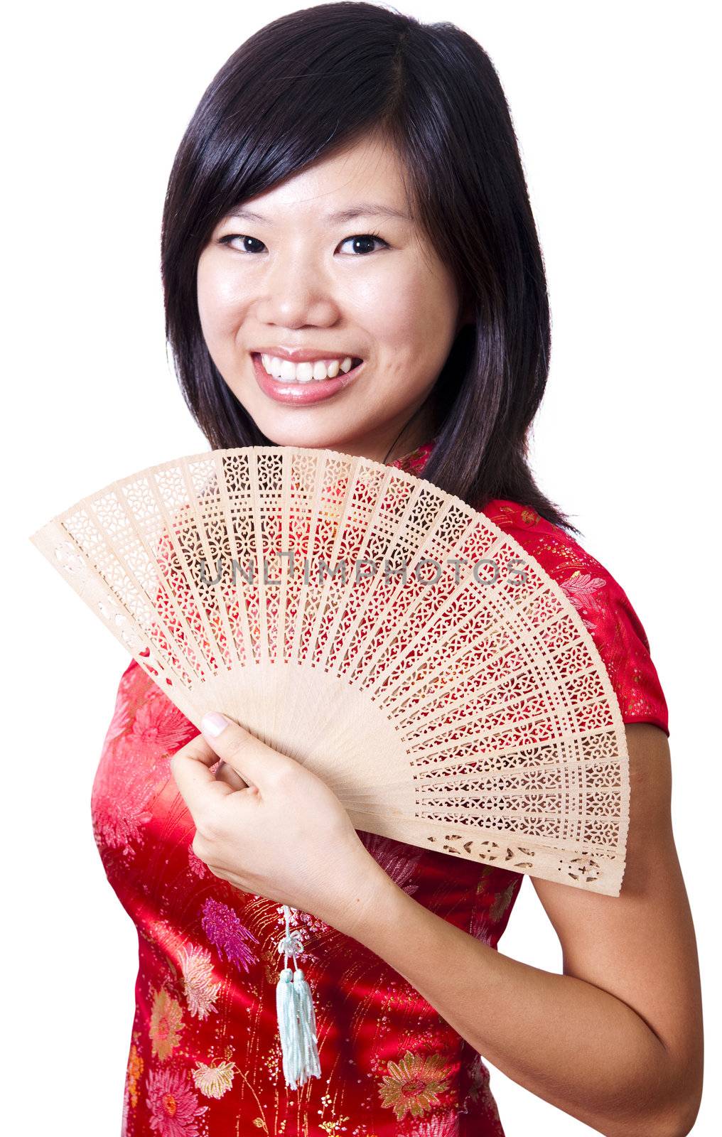 Oriental girl with Chinese traditional dress Cheongsam and Chinese Fan