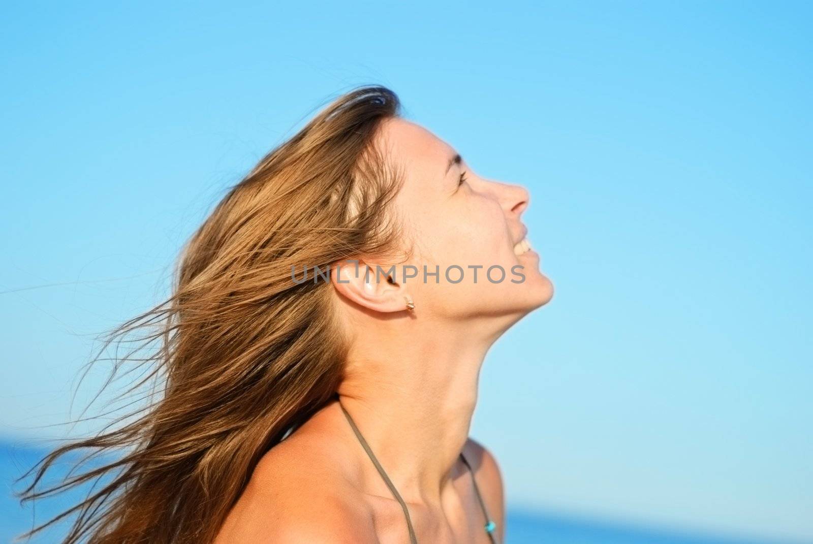 Young beautiful woman on a beach