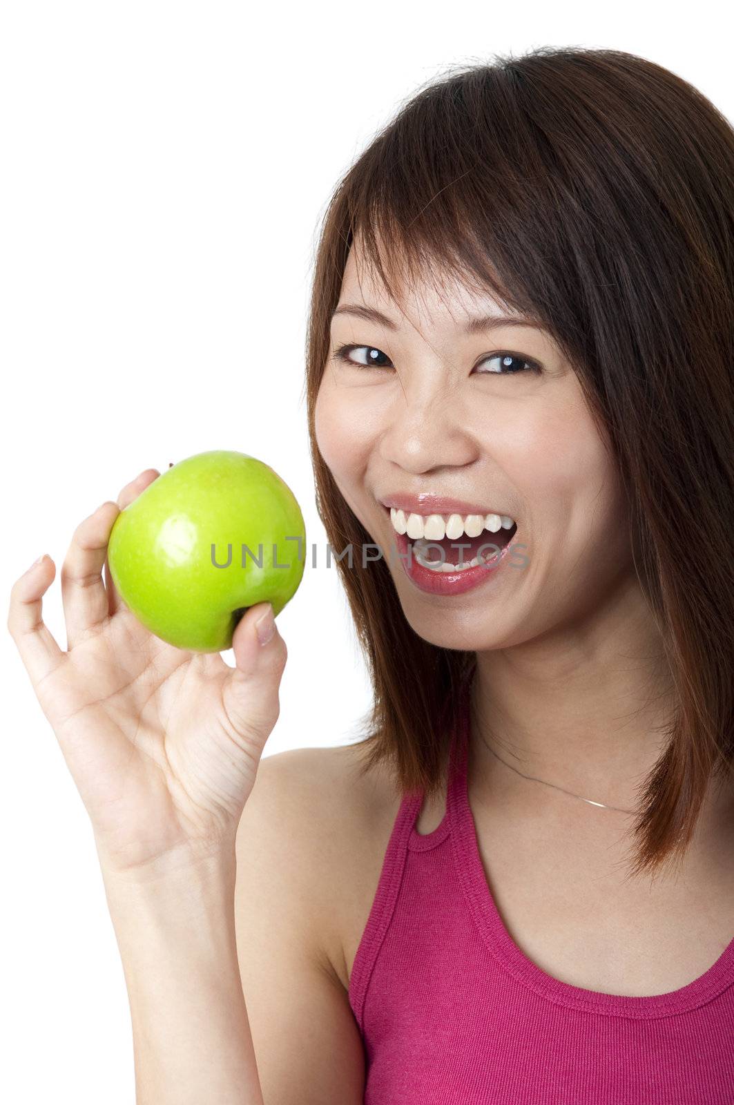 Beautiful young woman eating green apple. Isolated over white