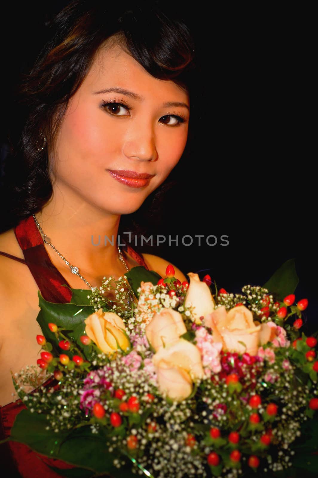 Asian bride with flower bouquet 
