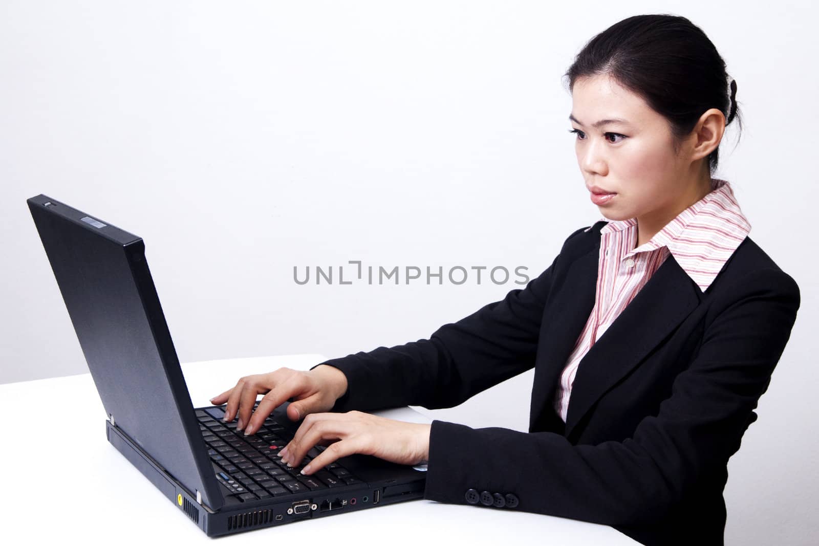 Asian business/educational women working with laptop