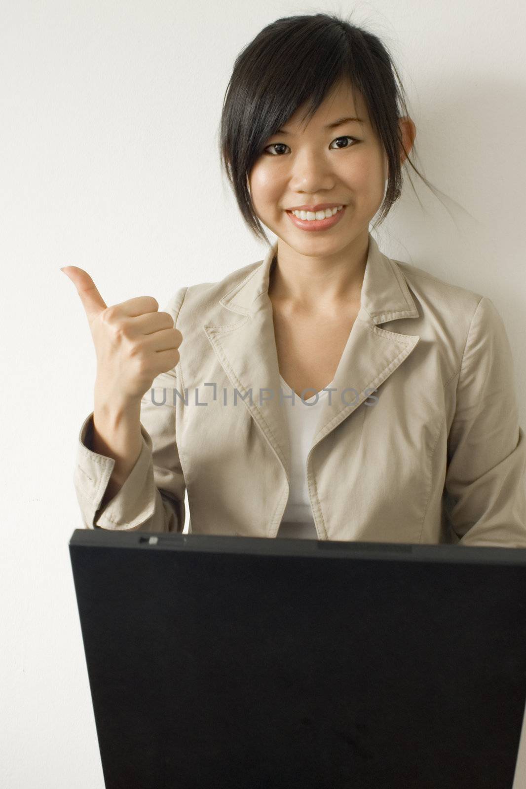 Business woman working with laptop by szefei