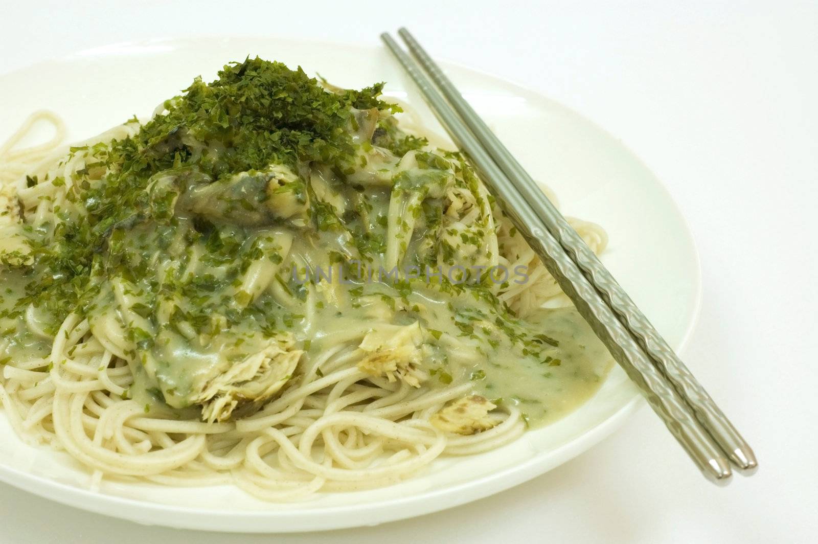 Asian noodles with fish meat, seaweed and mushroom source 

