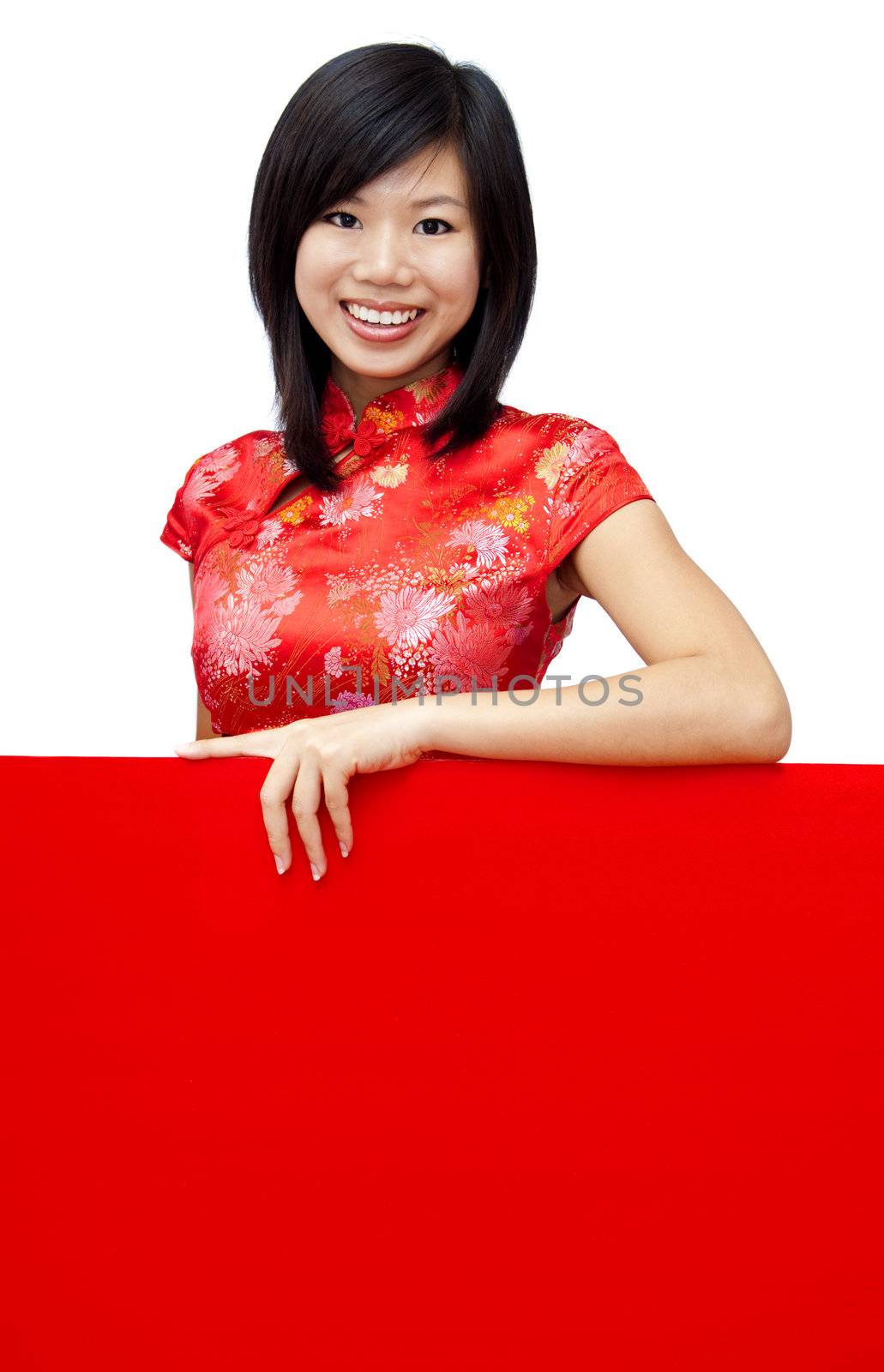Oriental girl with traditional Cheongsam holding a red blank card.