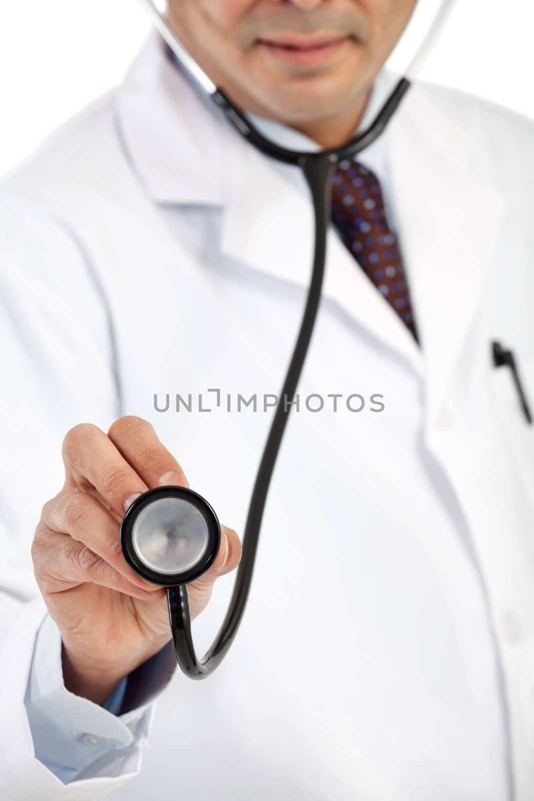 Mid section of a male doctor in lab coat holding a stethoscope. Focus on the stethoscope.