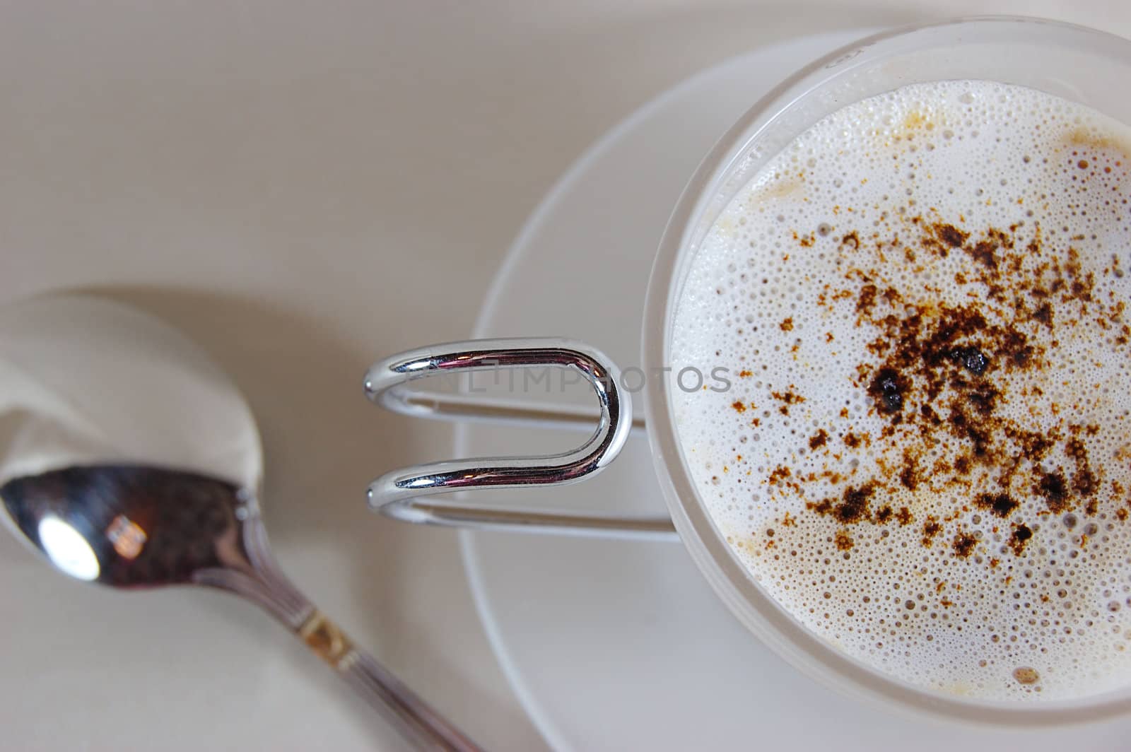 cup of cappuccino with spoon