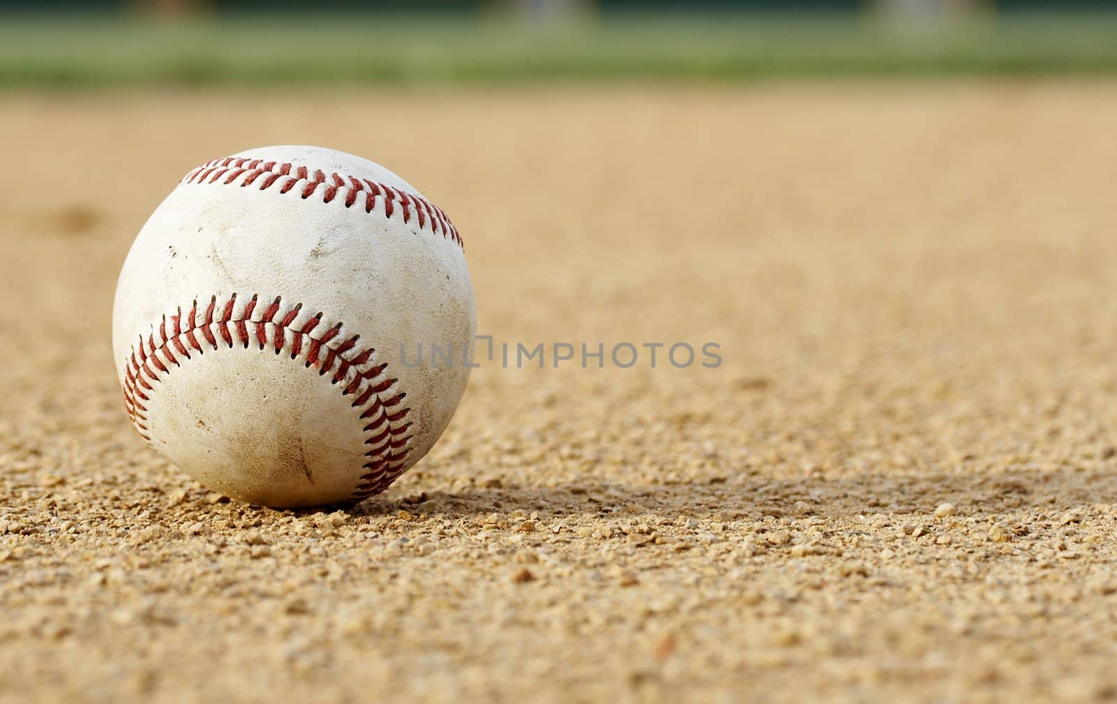 one baseball on infield of sport field