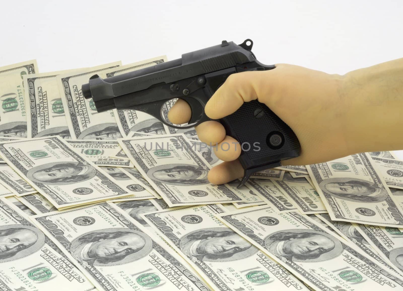 Gangster Holding a Handgun.  
Hand in a Rubber Glove Against Banknotes.