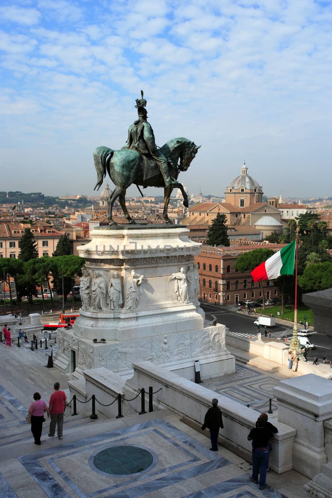 A view from just inside, under the tall Corinthian columns, of the equestrian sculpture of Vittorio Emanuele ll, in Rome, Italy.
