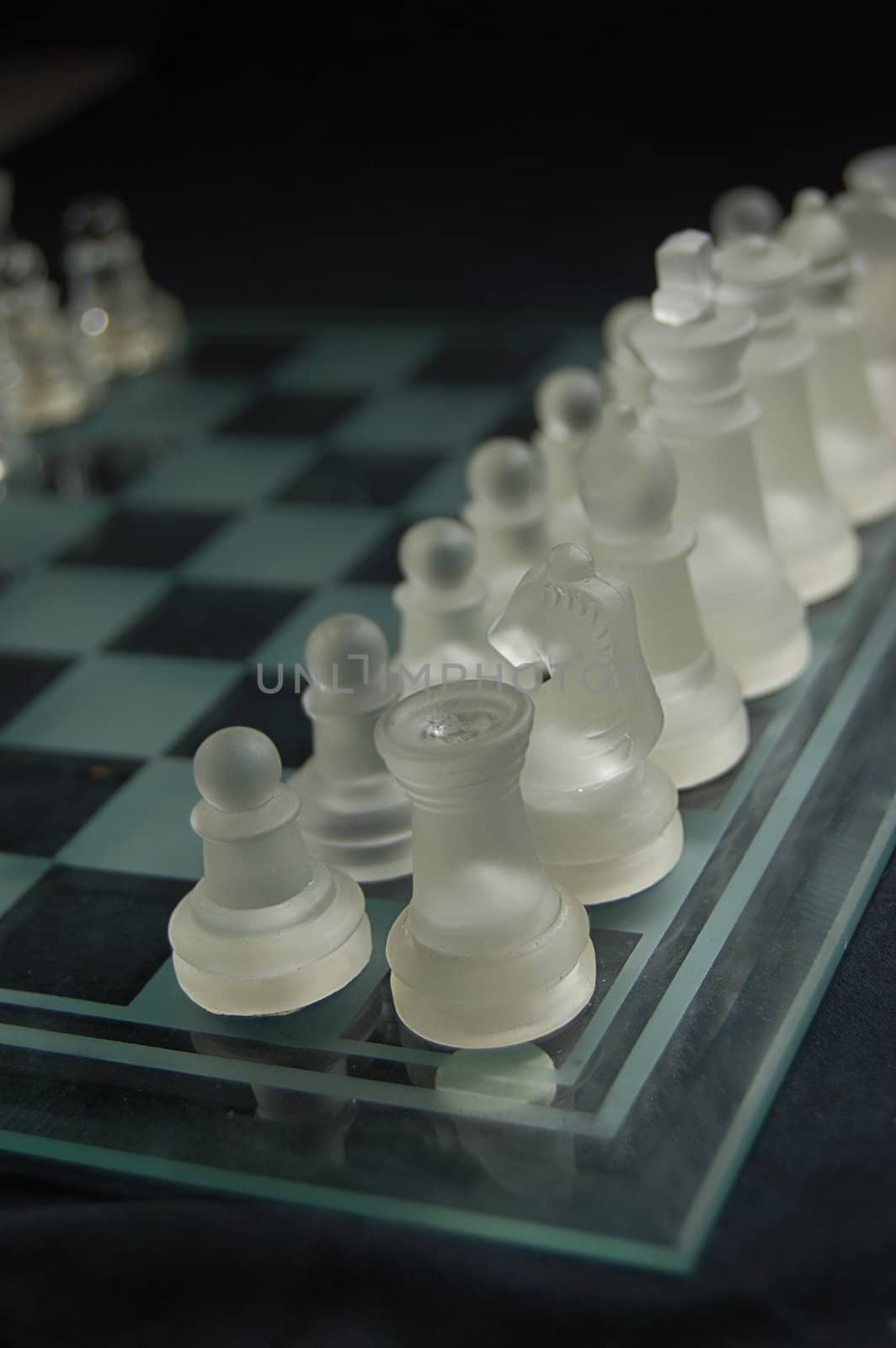 Set of glass chess on board