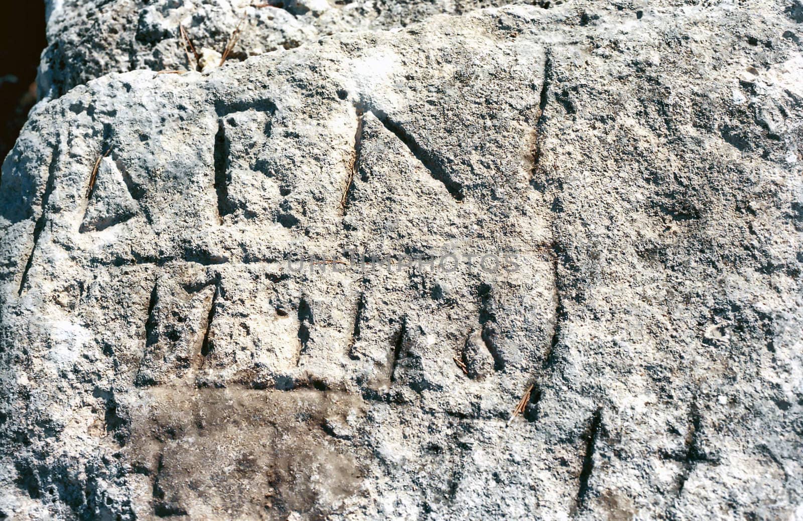  Background of ancient temple stone block with letters and figures