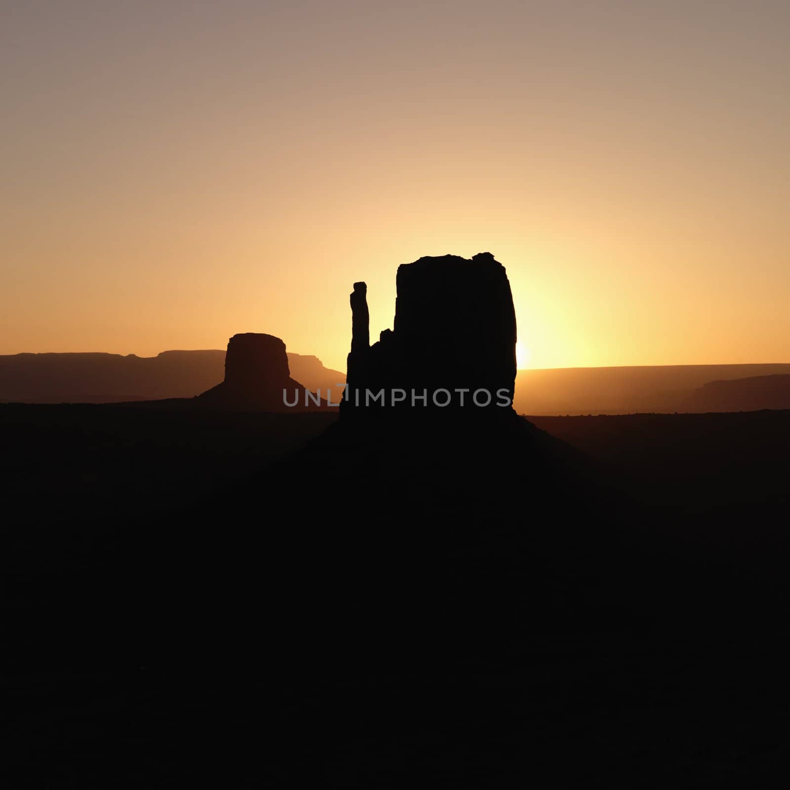 Scenic sunset landscape of mesas in Monument Valley near the border of Arizona and Utah, United States.