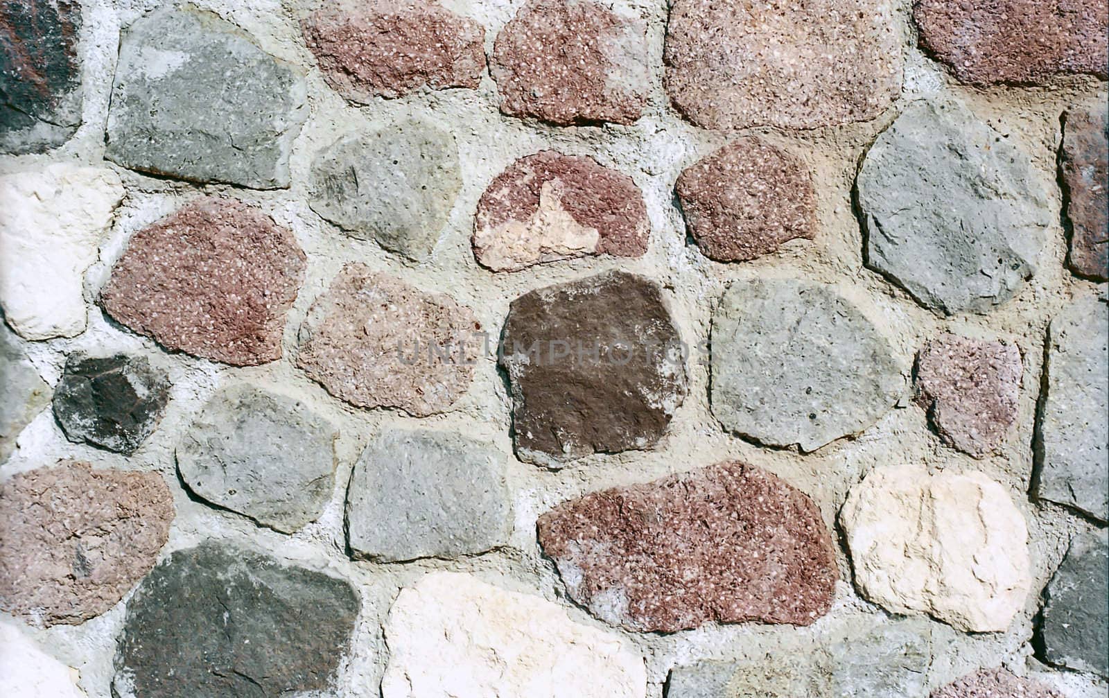 Multicolored stone wall as background