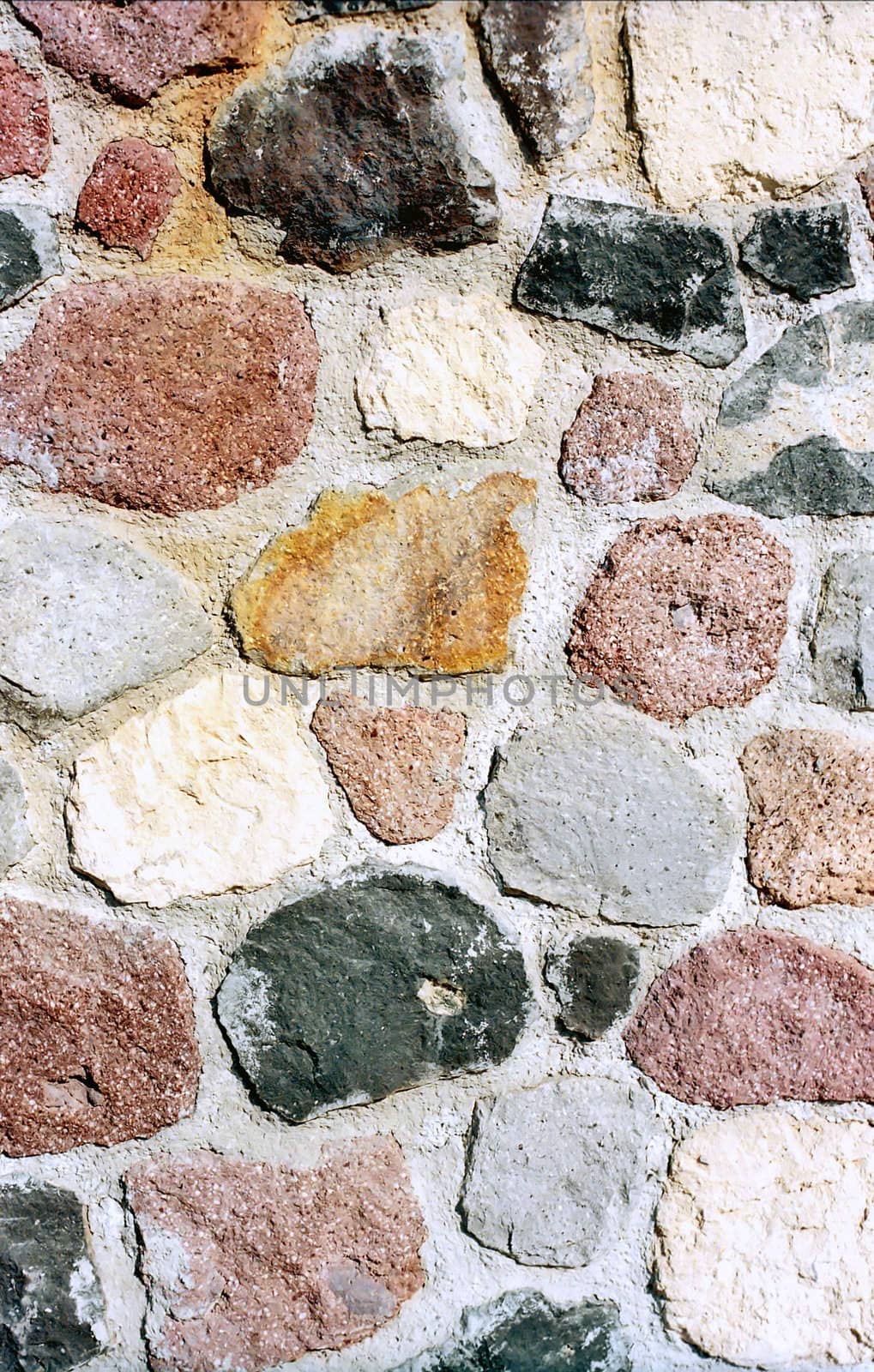 Multicolored stone wall as background