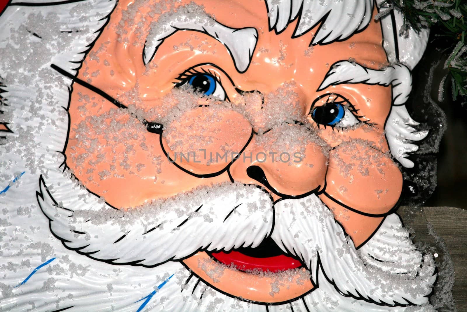 Portrait of santa claus of plastic covered with some snow