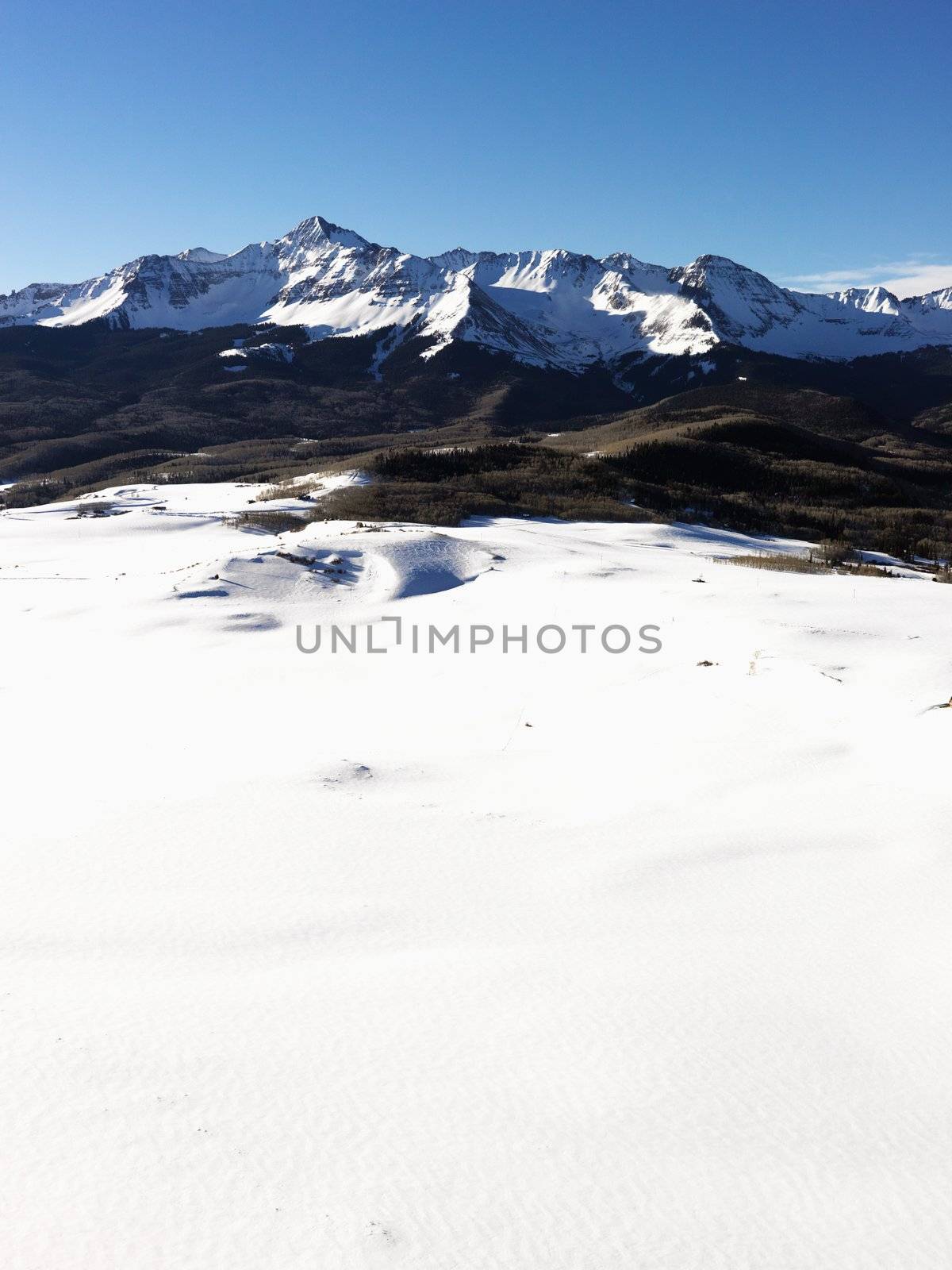 Snowy Colorado mountain landscape. by iofoto