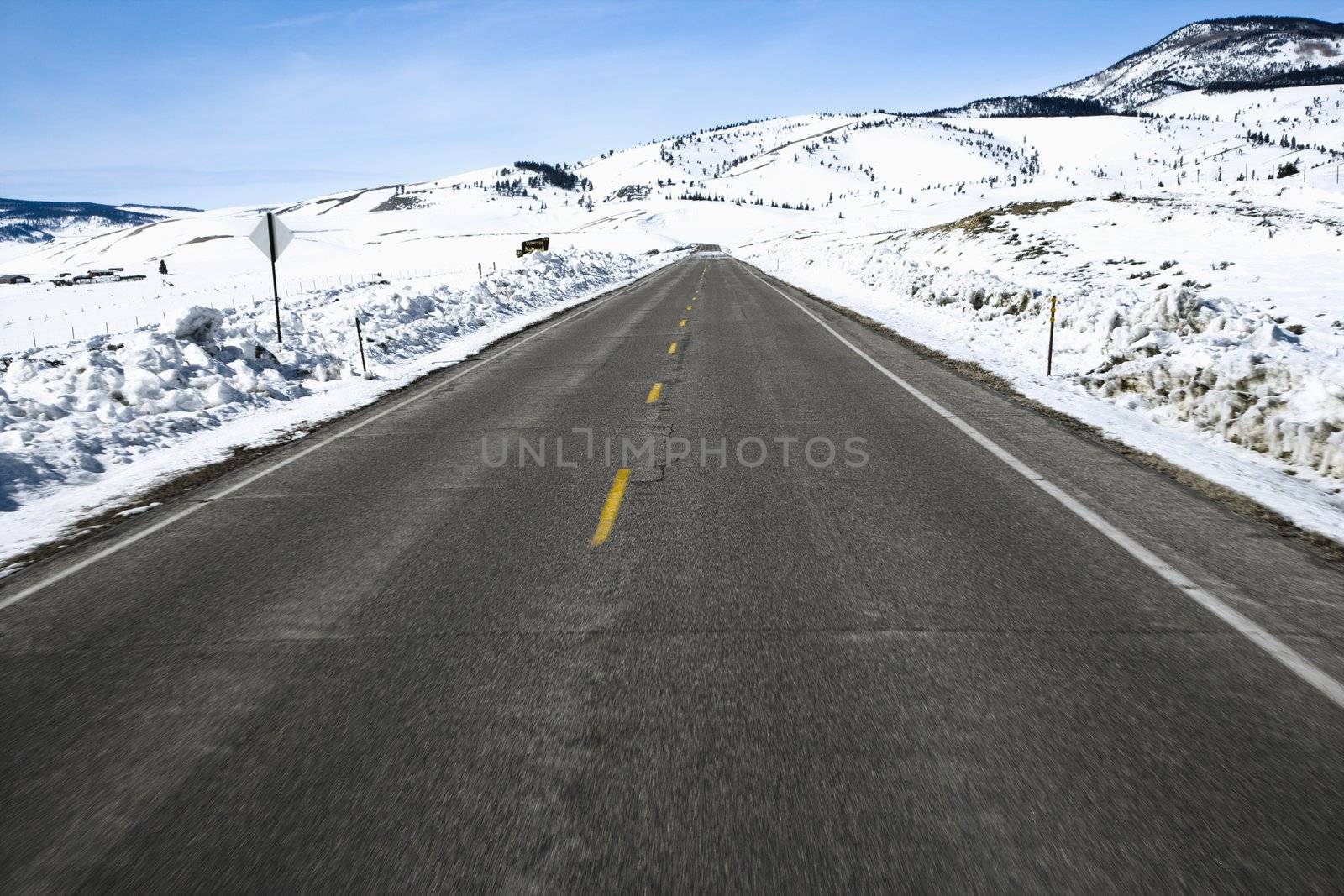 Perspective shot of road in snowy Colorado during winter.