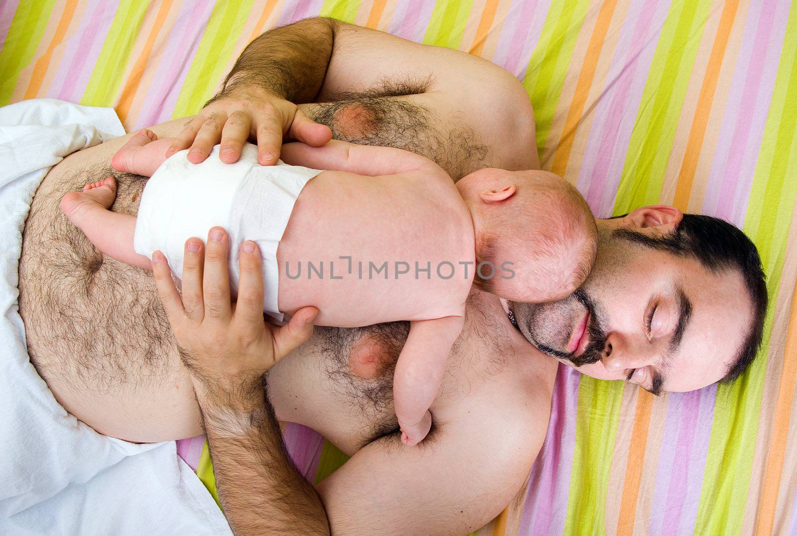 Baby asleep on his father's by Fanfo