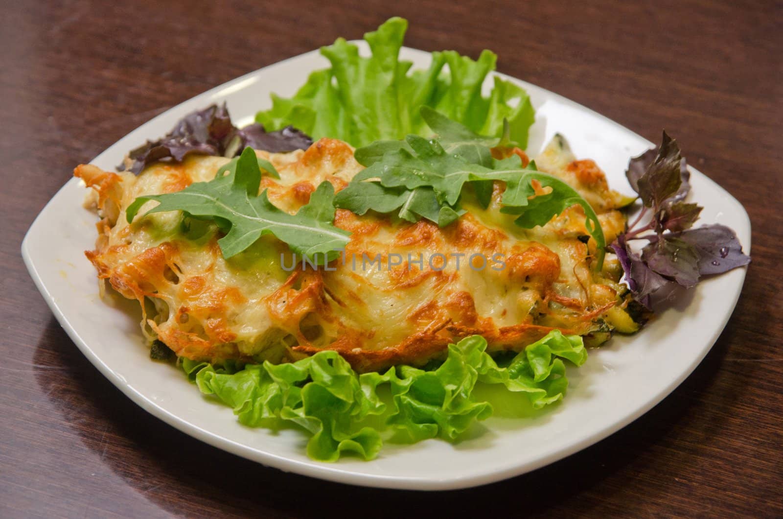 chicken fillet baked with zucchini, rucola lettuce