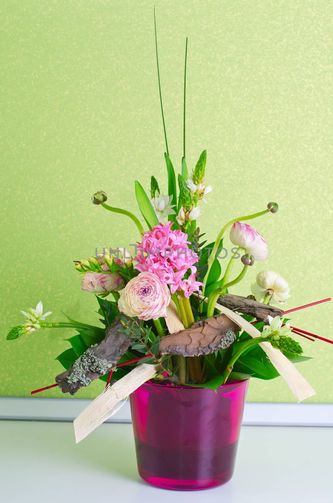 bunch of flowers composition at pot on a table