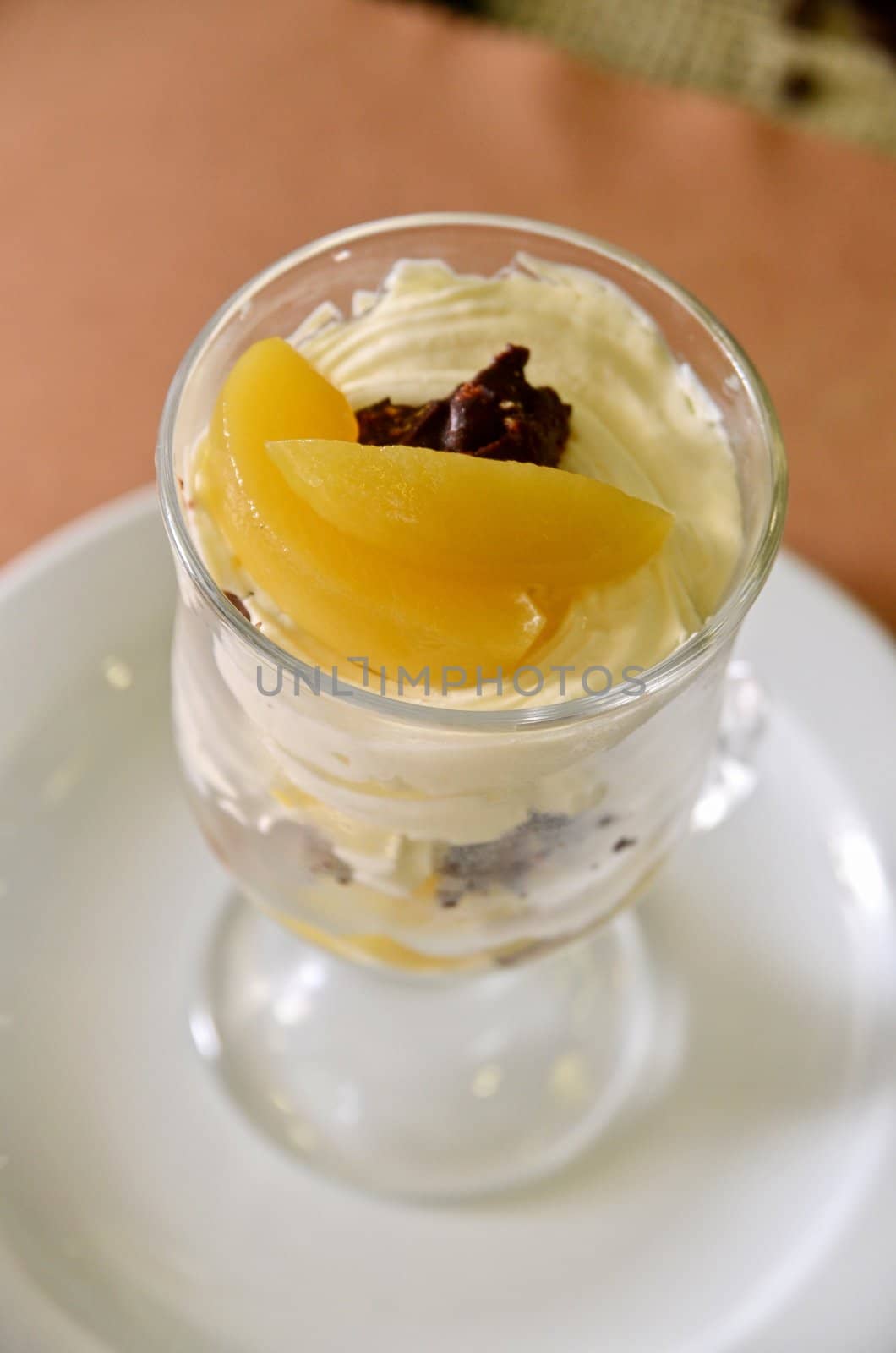 fresh baked cupcake with orange slices on a plate