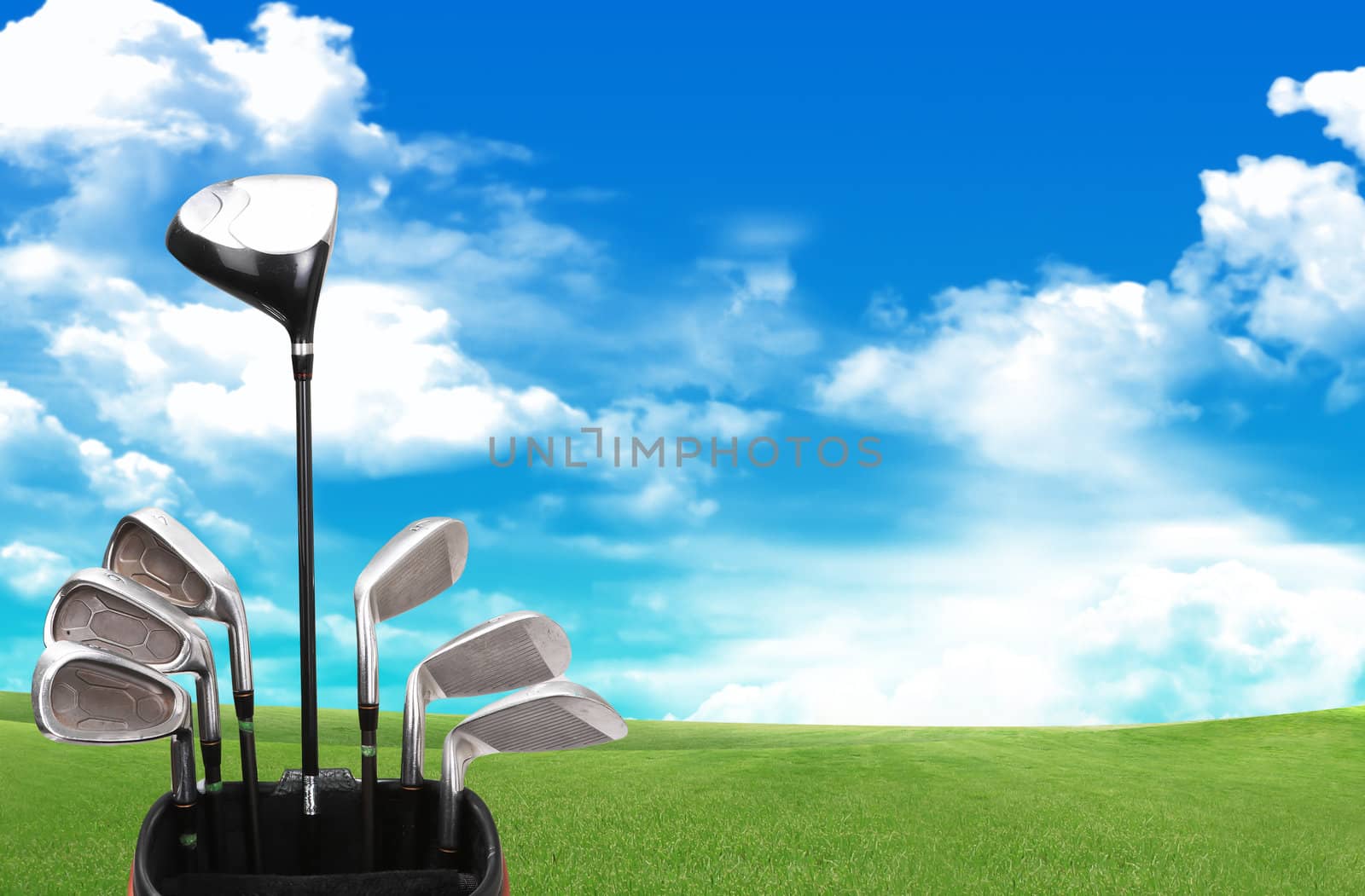 A set up new golf clubs on a beautiful golf course