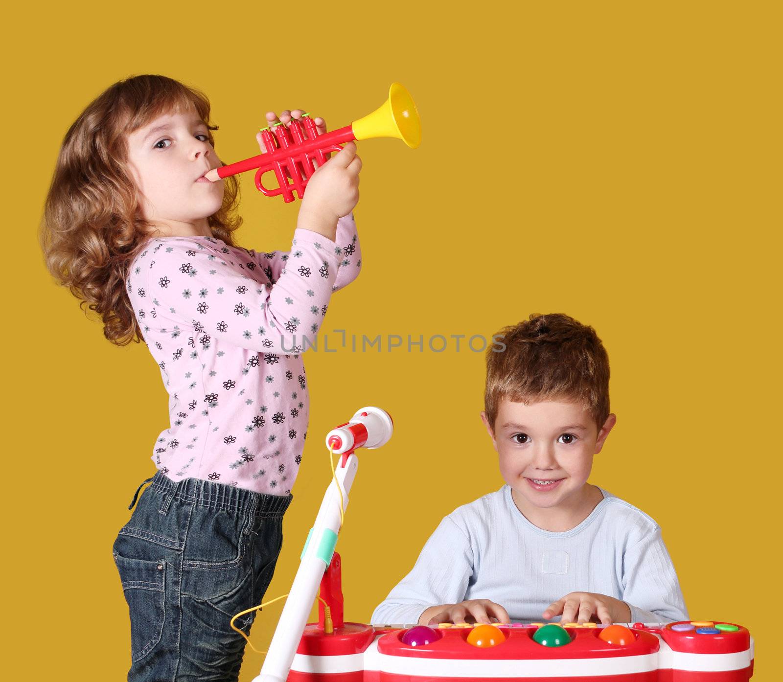 boy and little girl play music by goce