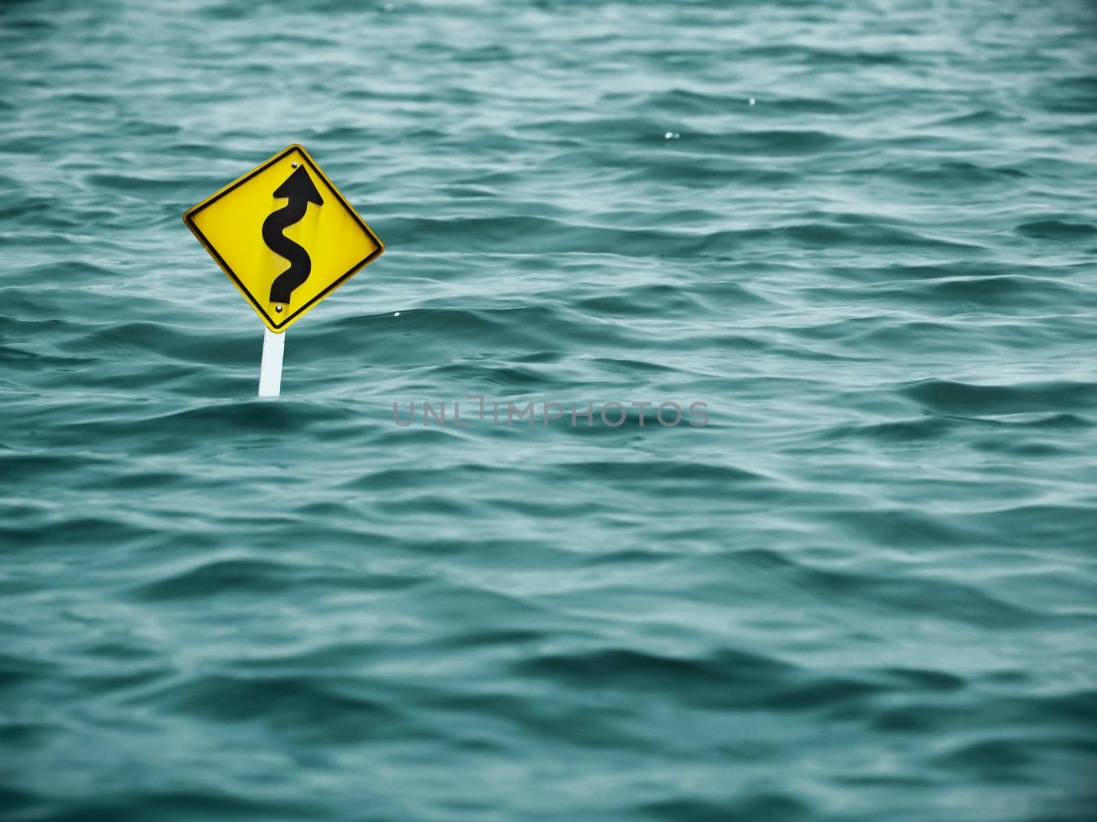 yellow sign of road in water