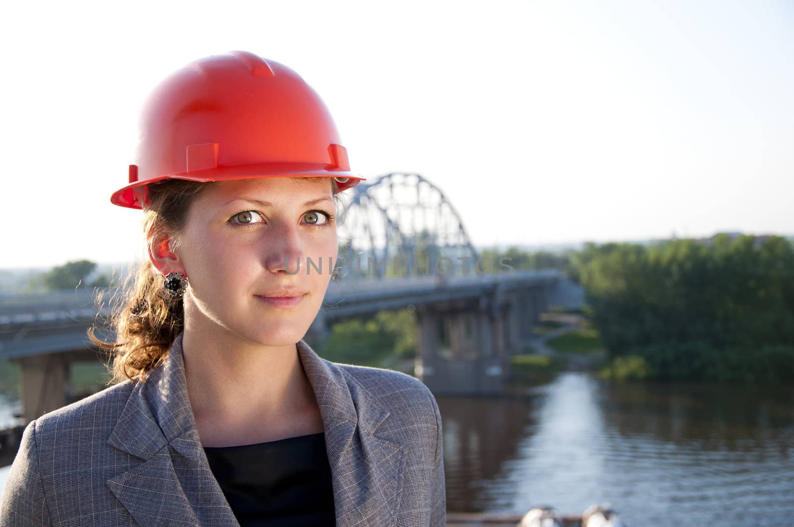 Young architect-woman wearing a protective helmet by adam121