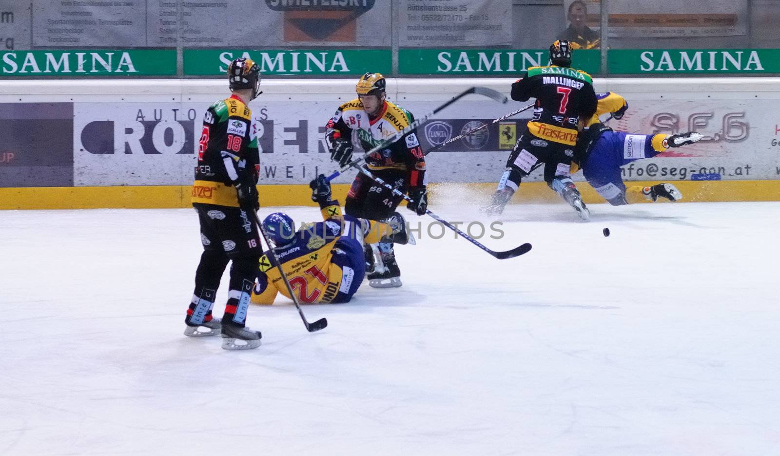 ZELL AM SEE, AUSTRIA - FEB 22: Austrian National League. Game gets chippy as the score is out of hand. Game EK Zell am See vs. VEU Feldkirch (Result 3-1) on February 22, 2011 at hockey rink of Zell am See