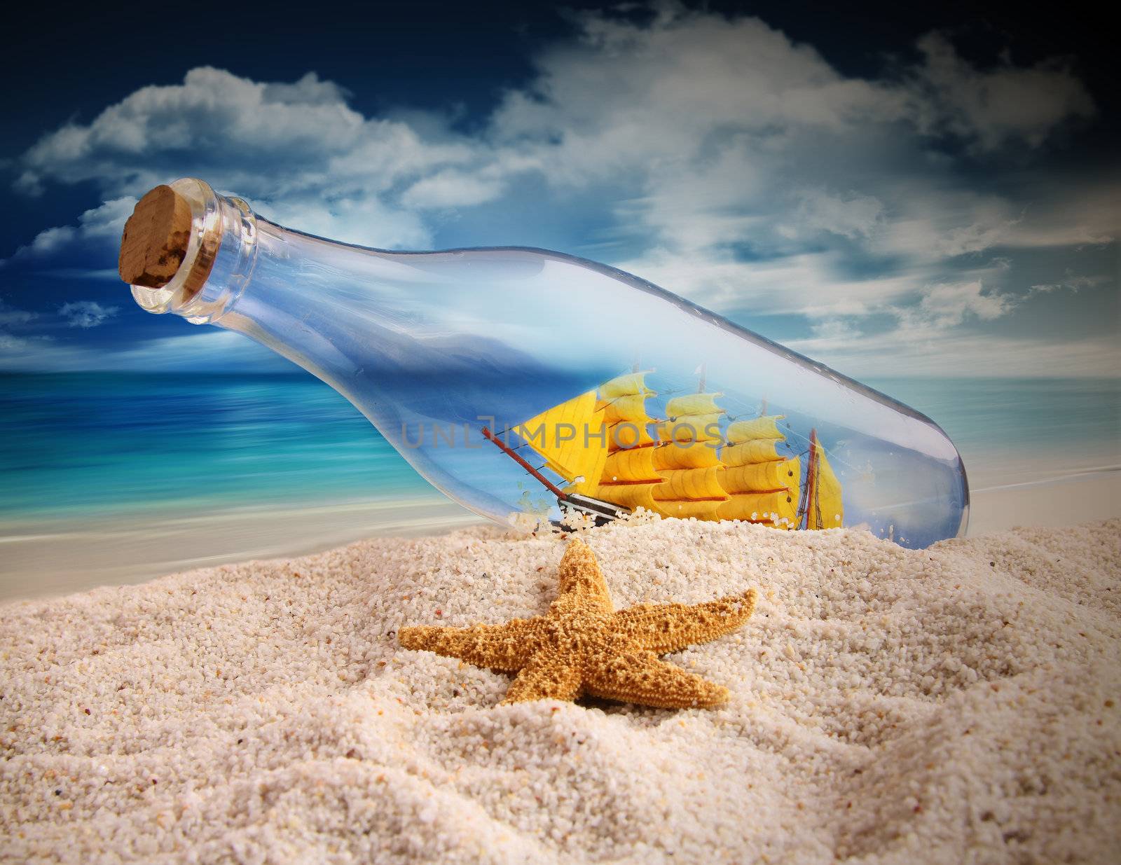 Ship in a bottle lying in the sand by Sandralise
