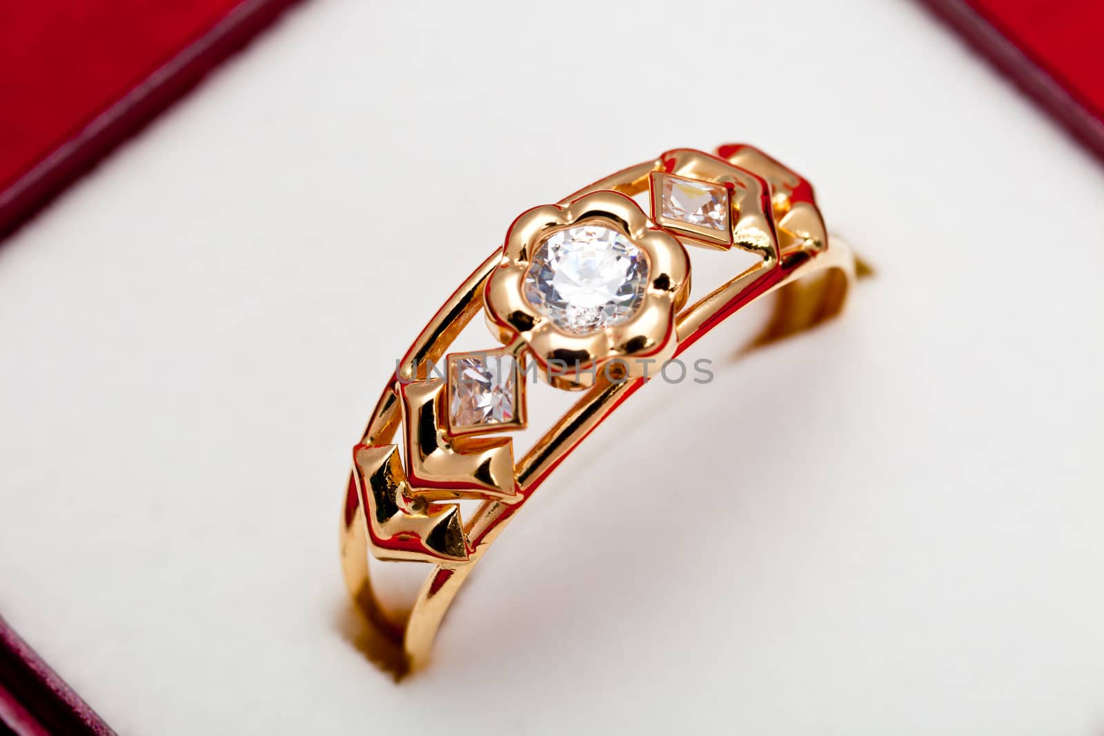 Fantastic gold ring adorned with several white zirconia