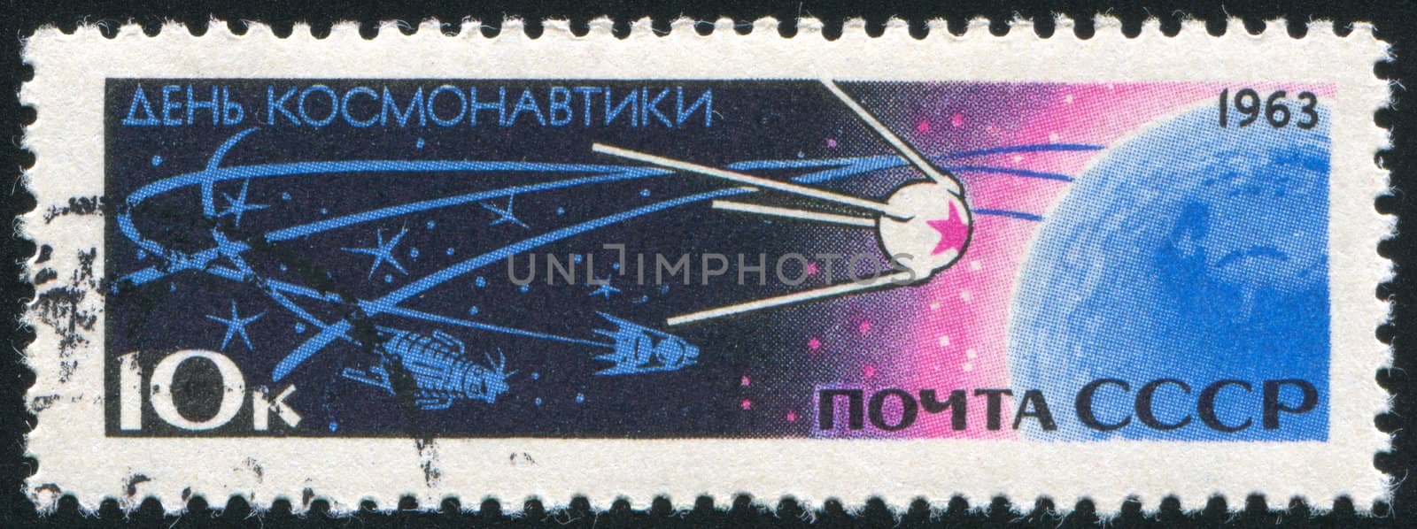 RUSSIA - CIRCA 1963: stamp printed by Russia, shows Sputnik and Earth, circa 1963