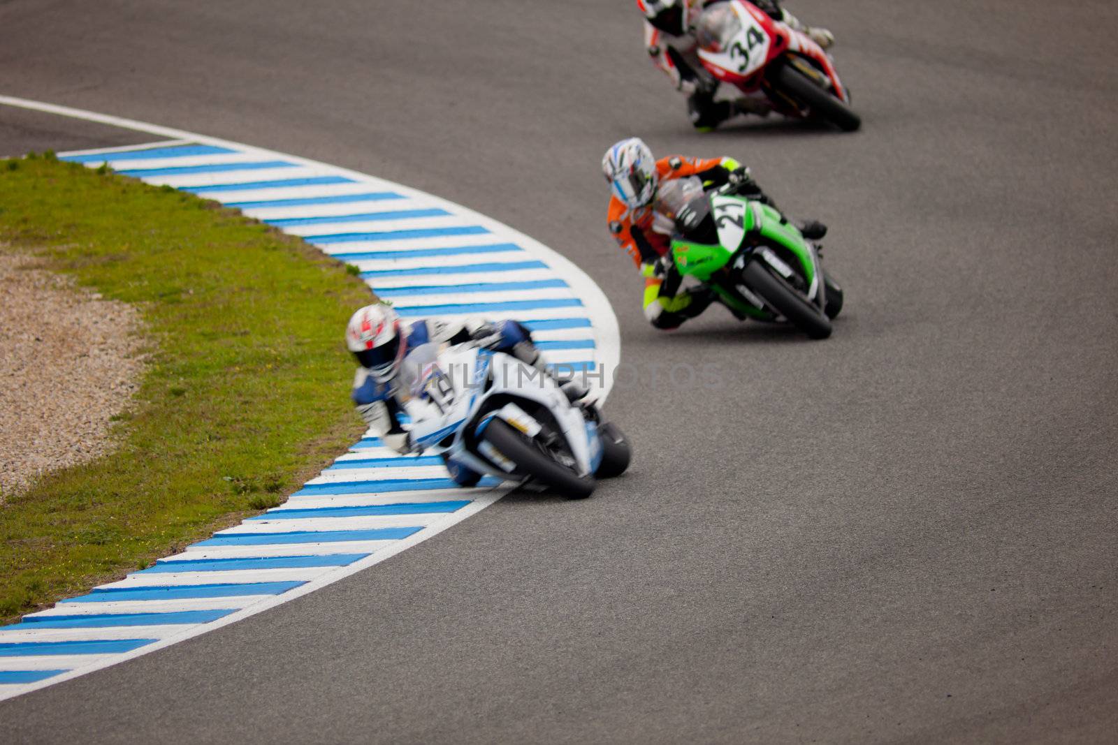 JEREZ DE LA FRONTERA, SPAIN - NOV 20: Stock Extreme motorcyclist Raul Gomez, Oscar Ibañez and Xavier Del Amor takes a curve in the CEV championship on Nov 20, 2010, in Jerez de la Frontera, Spain